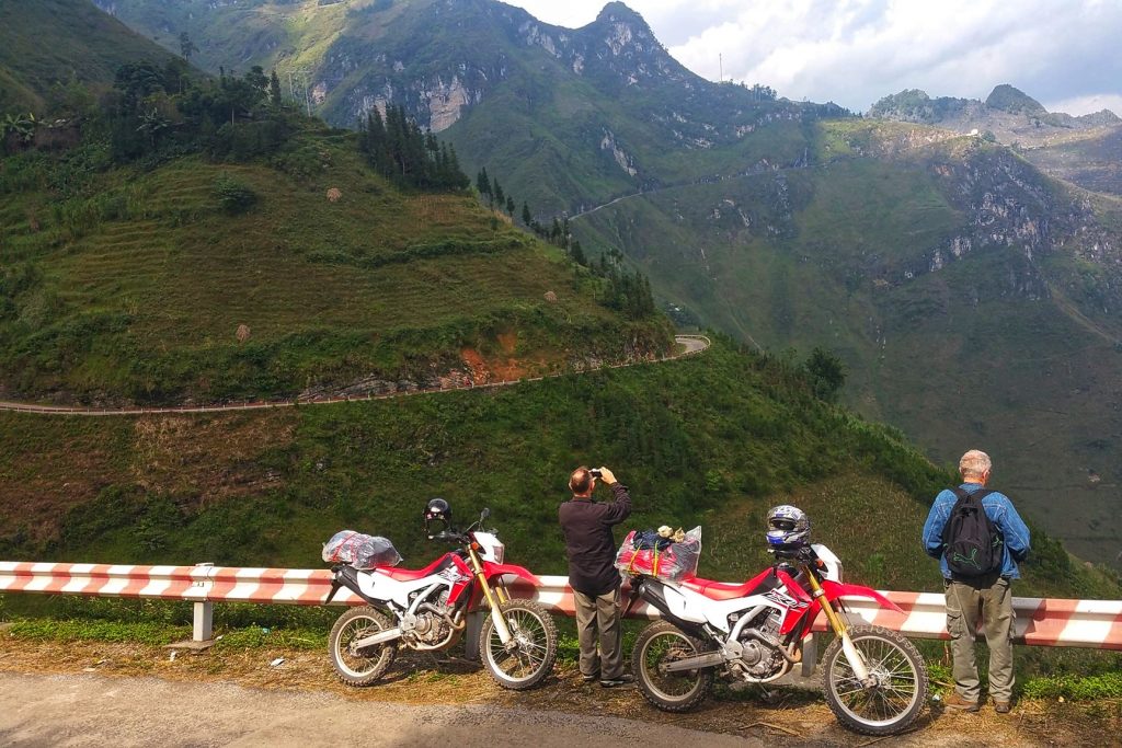 Tourists ride enduro motorbike in the north Vietnam tours