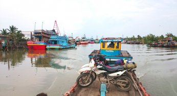 Ride motorcycle through a Vietnam Mekong delta village